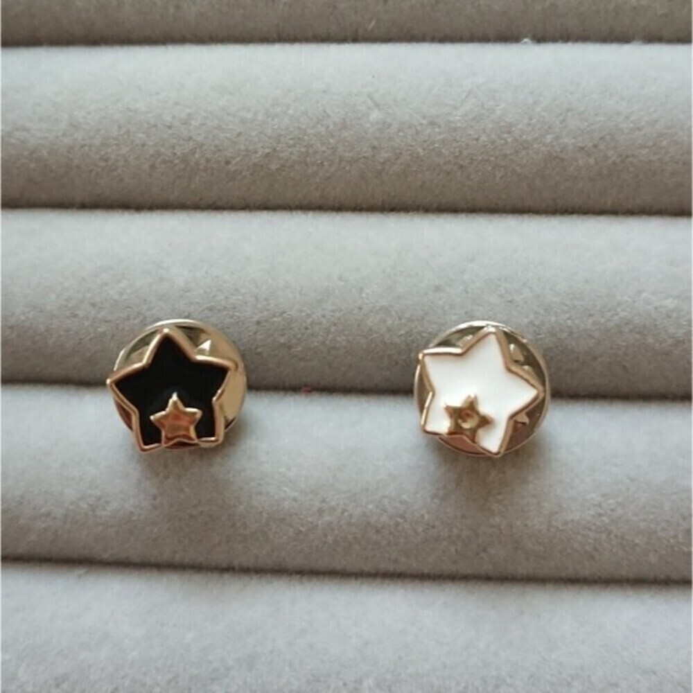 Black and white Star in star brooch/pins